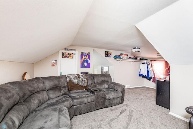 living room with lofted ceiling and carpet floors