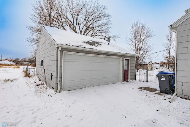 view of snow covered garage