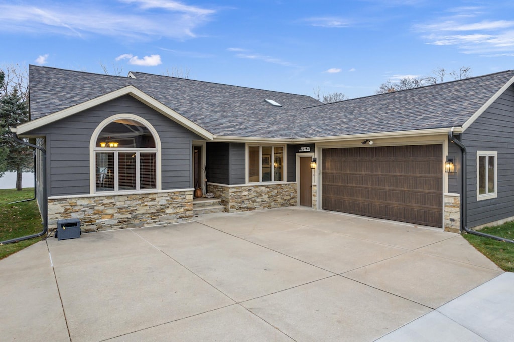 ranch-style home featuring a garage