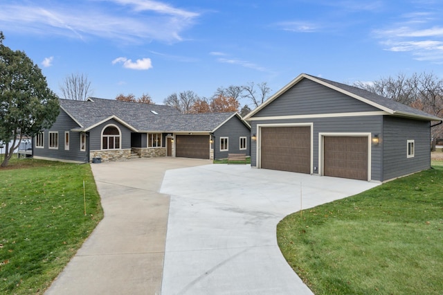 single story home with a garage and a front lawn