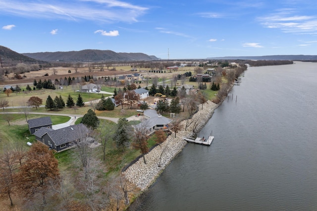 drone / aerial view with a water and mountain view