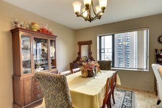 dining area with an inviting chandelier