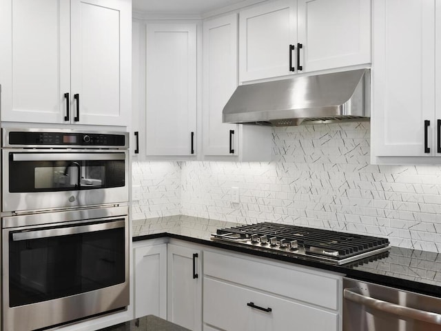 kitchen featuring backsplash, white cabinetry, and appliances with stainless steel finishes