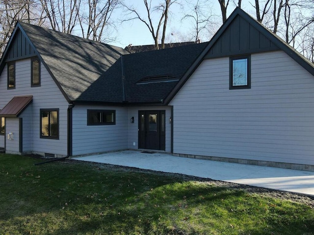 view of front facade with a front lawn and a patio area