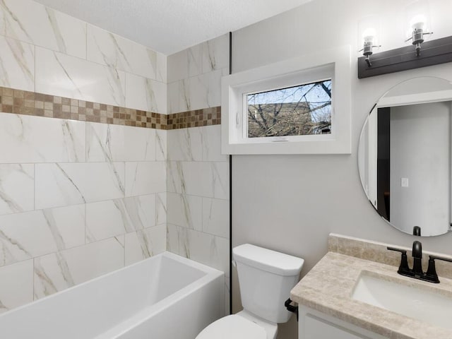 full bathroom featuring vanity, toilet, and tiled shower / bath