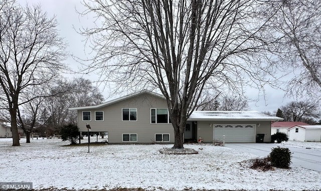 split level home featuring a garage