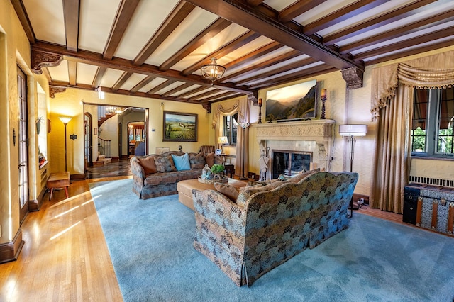 661 Market St, Winona, MN 55987 - living room featuring a premium fireplace, hardwood / wood-style floors, and beamed ceiling