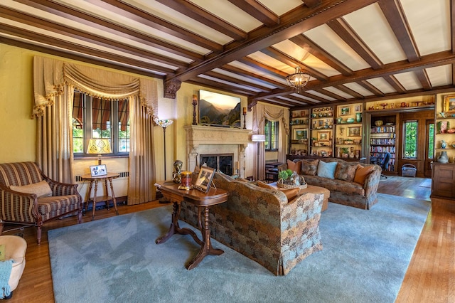 661 Market St, Winona, MN 55987 - living room featuring beamed ceiling, wood-type flooring, and a notable chandelier