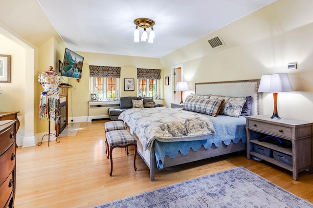 661 Market St, Winona, MN 55987 - bedroom featuring radiator and light hardwood / wood-style floors