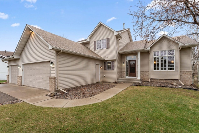 traditional home with roof with shingles, an attached garage, brick siding, a front yard, and driveway