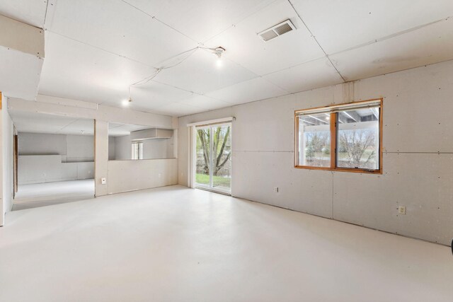 empty room with visible vents and finished concrete floors