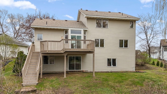 back of house featuring a lawn, a wooden deck, and stairway