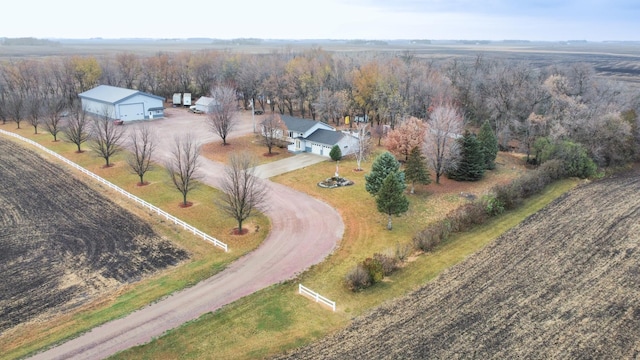 birds eye view of property with a rural view