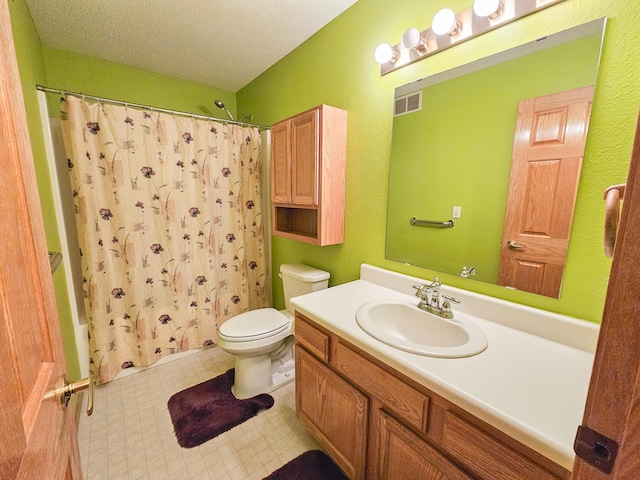 full bathroom featuring vanity, shower / tub combo, a textured ceiling, and toilet