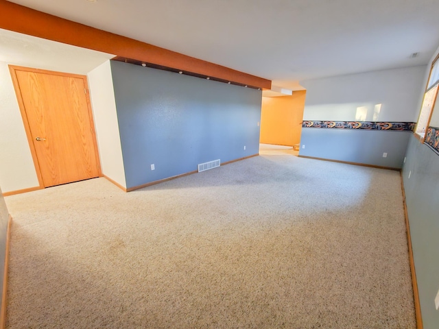 empty room featuring carpet flooring