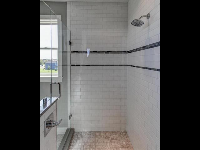 full bathroom with a shower stall