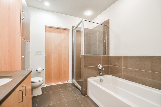 full bathroom with tile patterned floors, vanity, toilet, and shower with separate bathtub