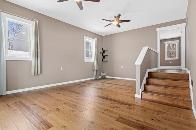 interior space with hardwood / wood-style flooring and ceiling fan