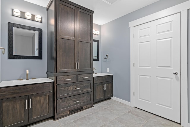 bathroom with vanity and tile patterned flooring