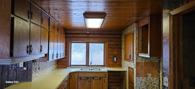 kitchen with tasteful backsplash, sink, and wooden ceiling