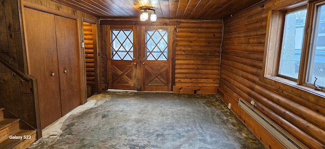 foyer entrance with wood ceiling, a baseboard radiator, and french doors