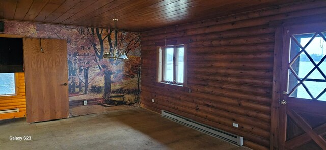 interior space featuring baseboard heating, rustic walls, plenty of natural light, and wooden ceiling