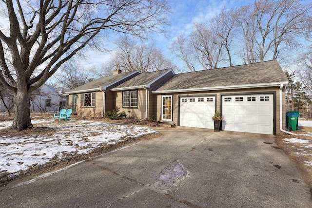 ranch-style house featuring a garage