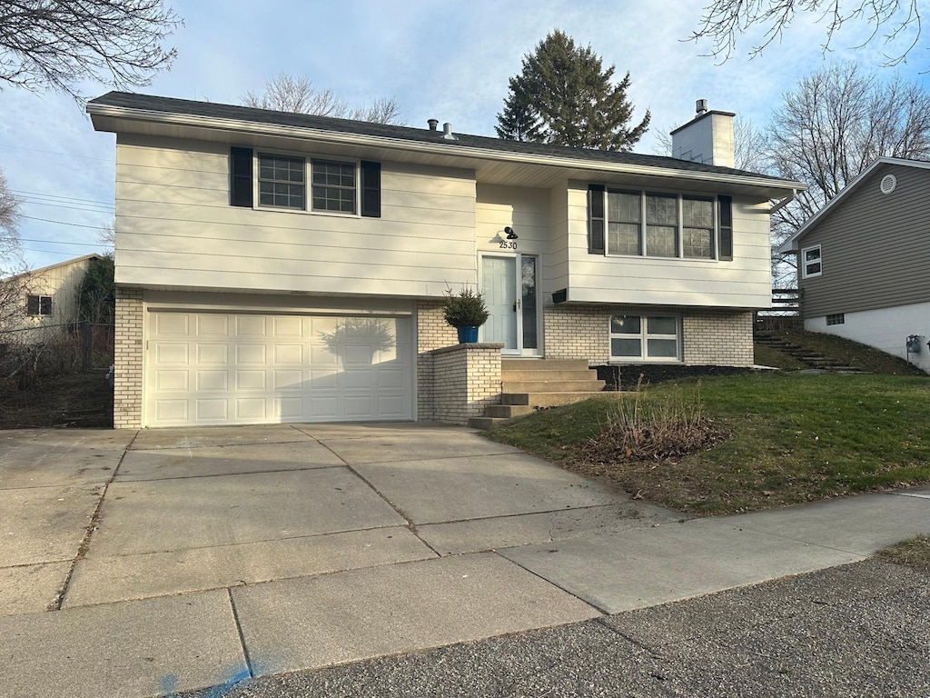 split foyer home featuring a garage