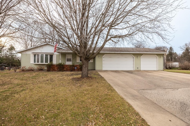 single story home with a front yard and a garage