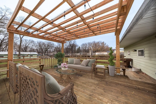 wooden terrace featuring a pergola and an outdoor hangout area