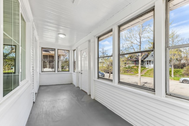 unfurnished sunroom featuring plenty of natural light