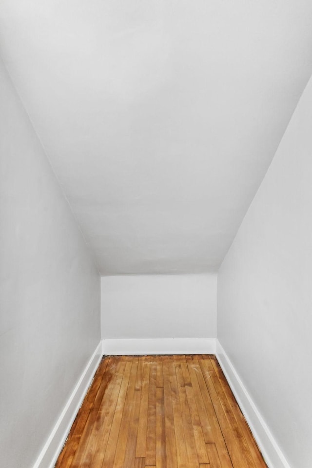 bonus room with hardwood / wood-style flooring