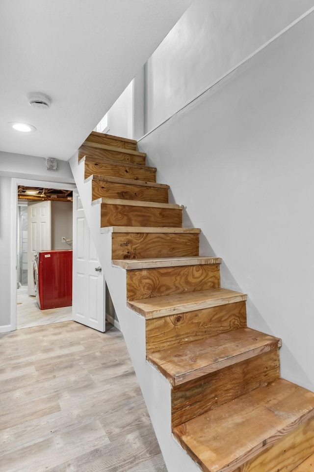 staircase featuring hardwood / wood-style flooring