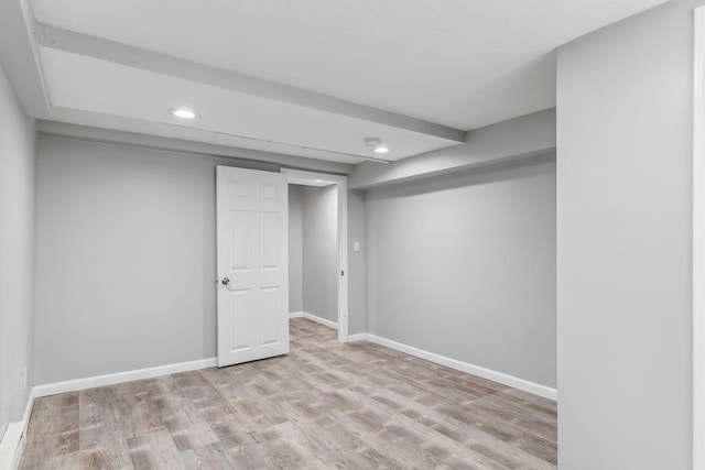 basement featuring light wood-type flooring