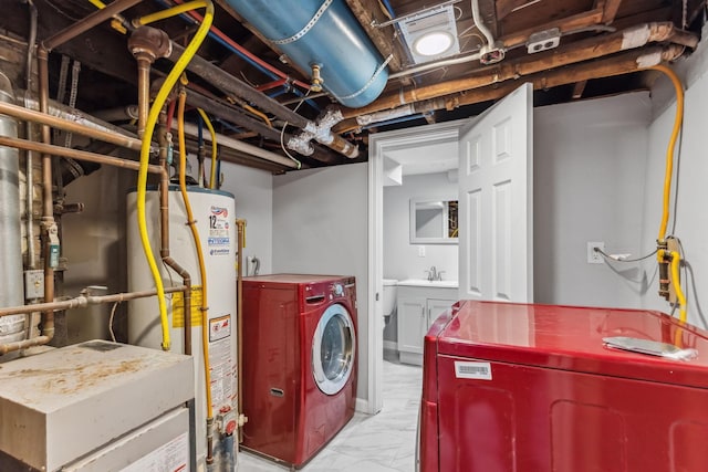 laundry room with sink, gas water heater, and washing machine and clothes dryer