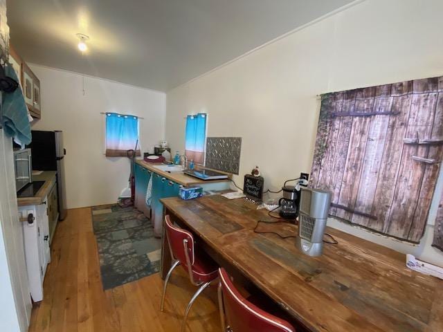 office with light wood-type flooring