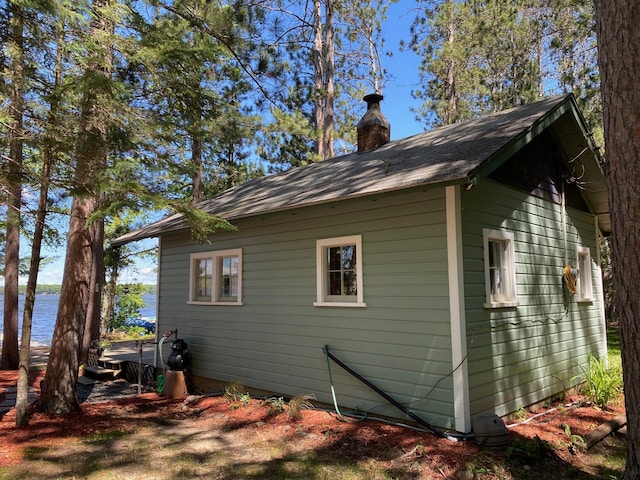 view of side of property with a water view