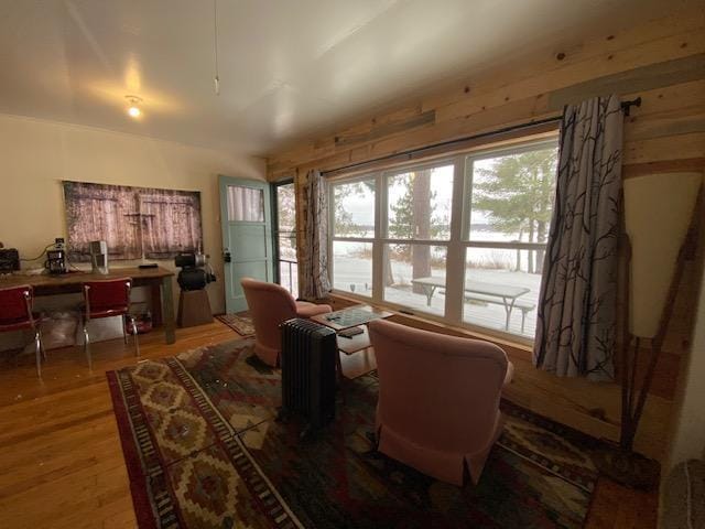 interior space featuring hardwood / wood-style floors and wooden walls