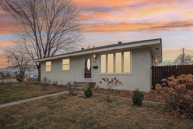 view of front of home with a lawn