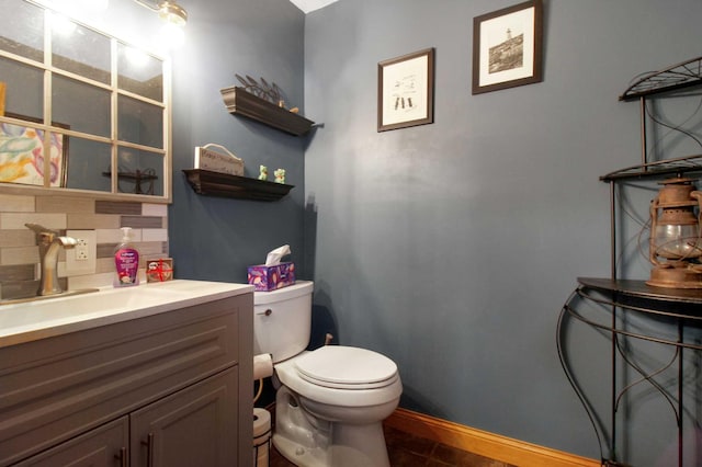 bathroom with tile patterned floors, vanity, and toilet