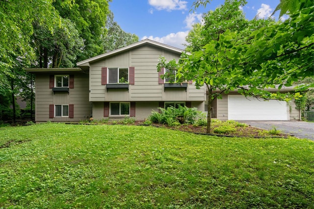 view of front of home featuring a garage and a front lawn