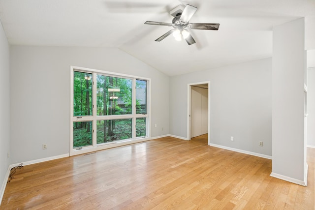 empty room with light hardwood / wood-style floors, ceiling fan, and lofted ceiling