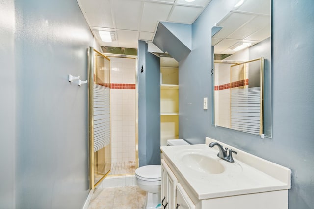 bathroom with tile patterned flooring, toilet, an enclosed shower, and vanity