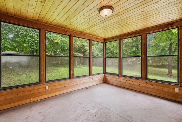 unfurnished sunroom with wooden ceiling