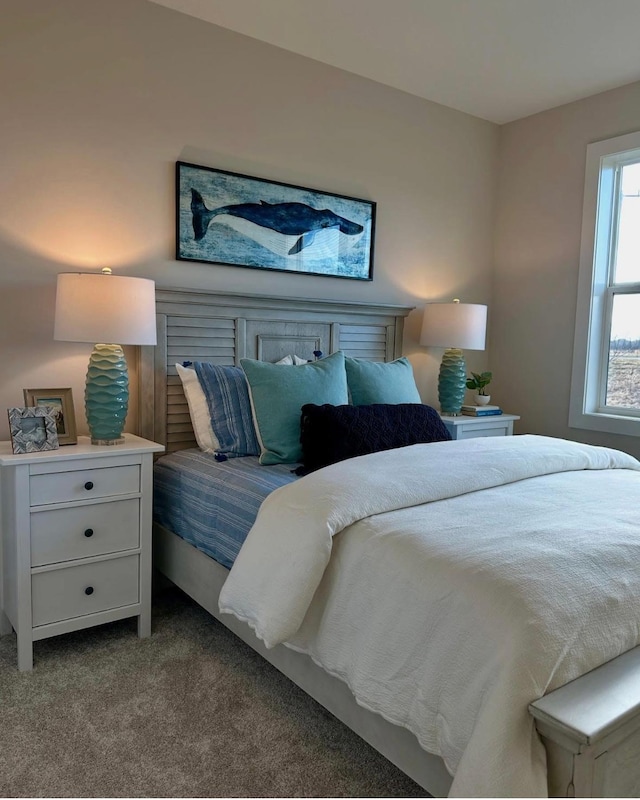 bedroom with light colored carpet