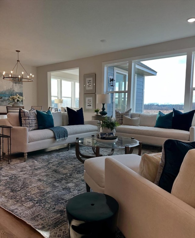 living room featuring hardwood / wood-style flooring and a chandelier