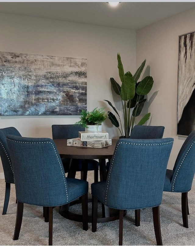 dining space with carpet floors