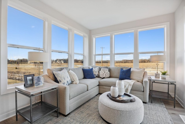 sunroom / solarium featuring a rural view