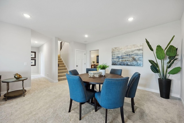 dining area with light carpet