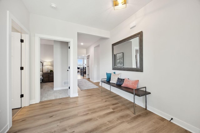 hall with light wood-type flooring